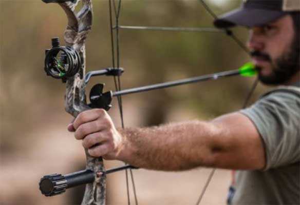 Image of a man drawing a bow and arrow